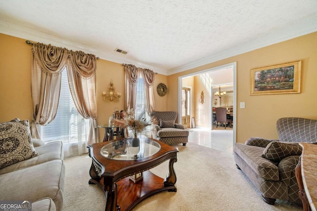 living room featuring carpet floors, ornamental molding, a chandelier, and a textured ceiling