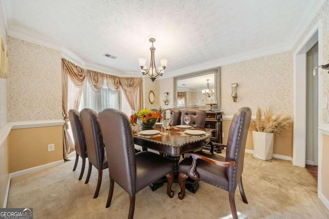 dining space with ornamental molding, light colored carpet, a chandelier, and a textured ceiling