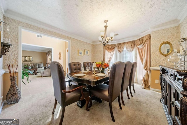 carpeted dining area with ornamental molding, a notable chandelier, and a textured ceiling