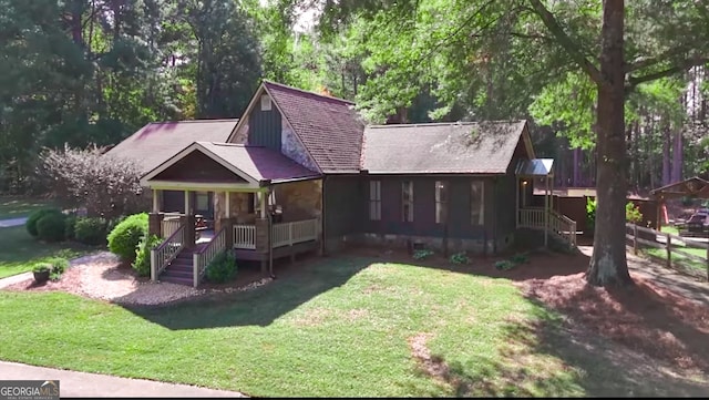 view of front of property with a porch and a front yard