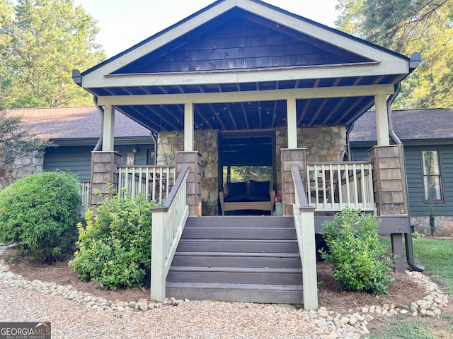 doorway to property with a porch