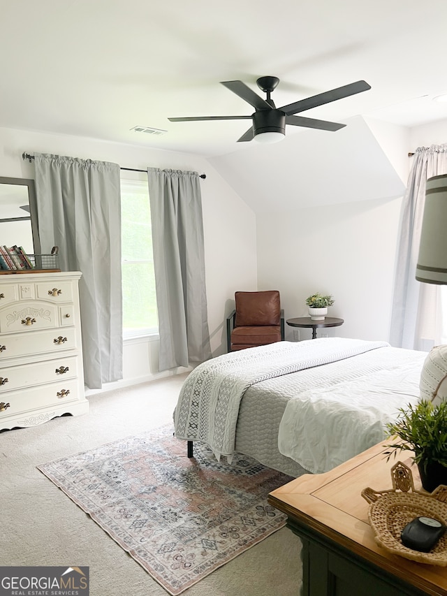 bedroom with carpet floors, vaulted ceiling, and ceiling fan