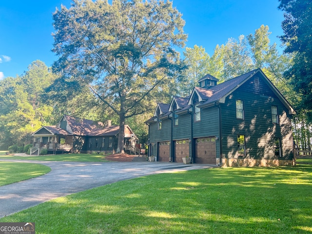 view of side of home featuring a yard and a garage