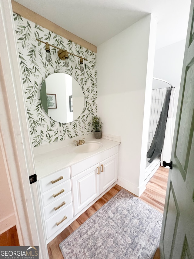 bathroom featuring hardwood / wood-style floors and vanity