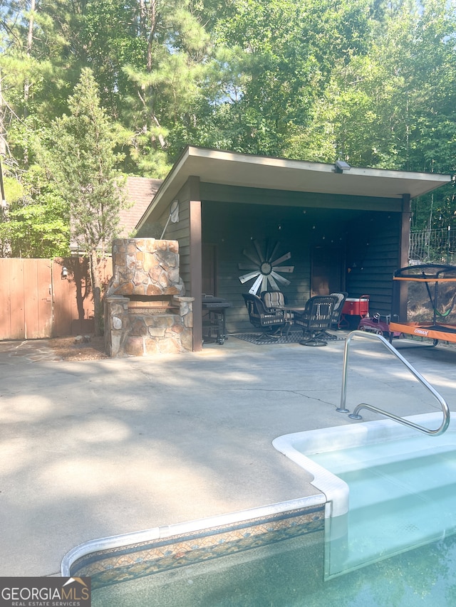 view of swimming pool with a patio area