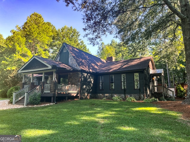 view of front of home with a front yard and a porch