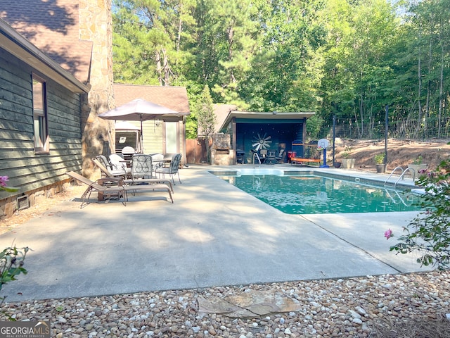 view of pool featuring a patio area