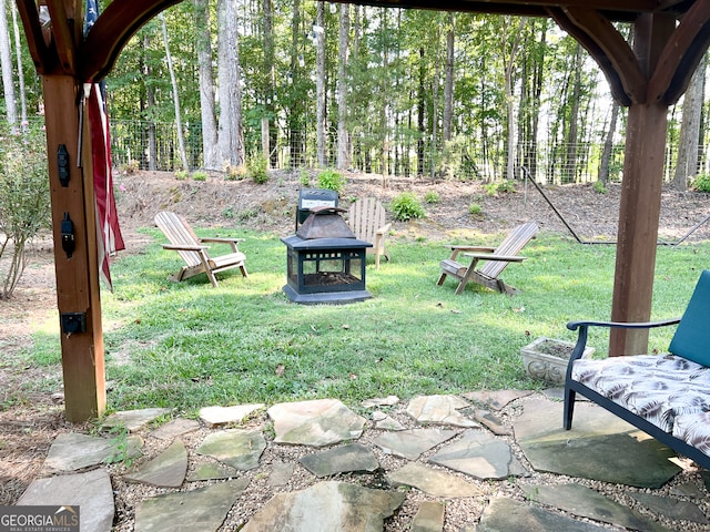 view of yard with a patio area and an outdoor fire pit