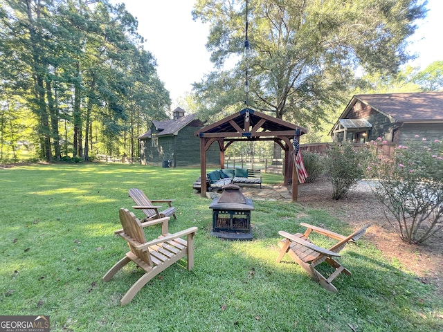 view of yard with a gazebo and an outdoor fire pit