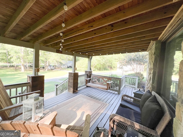 wooden terrace with a yard