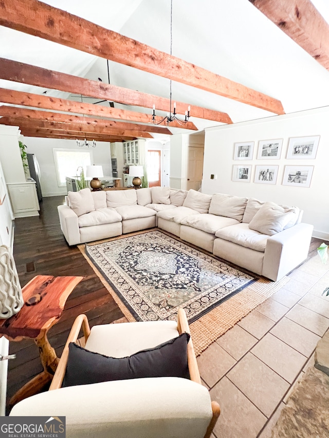 living room with dark hardwood / wood-style flooring and vaulted ceiling with beams