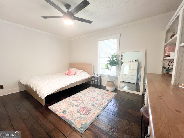 bedroom featuring ceiling fan, ornamental molding, and dark wood-type flooring