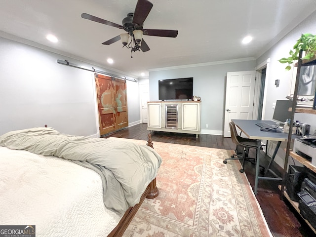 bedroom featuring a barn door, ceiling fan, dark hardwood / wood-style flooring, and crown molding