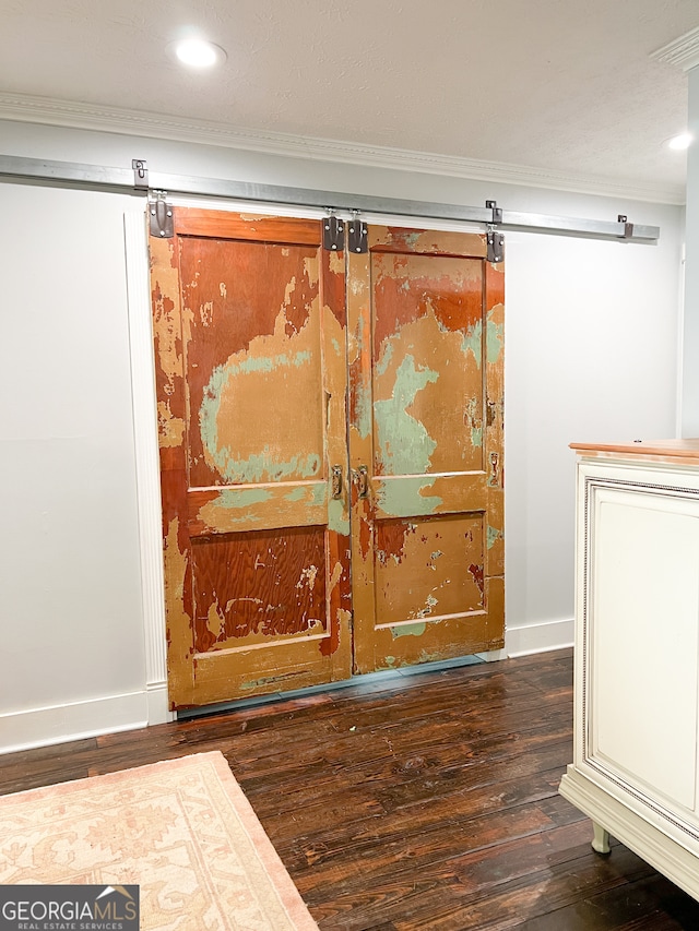 room details with hardwood / wood-style flooring and crown molding