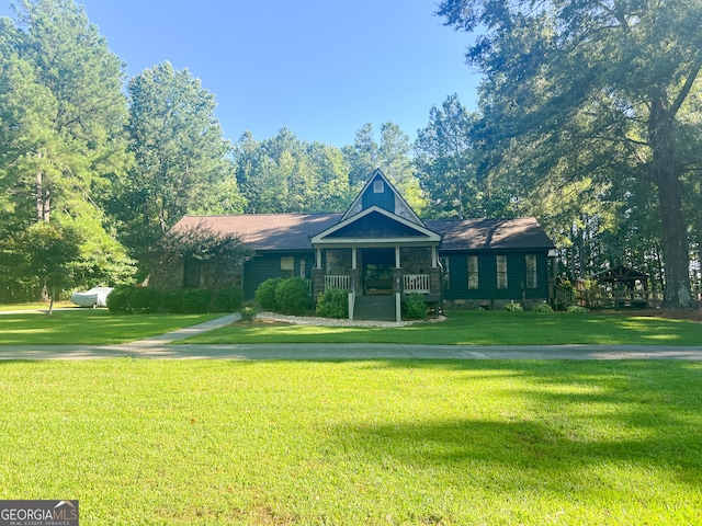 view of front of house featuring a front yard and covered porch