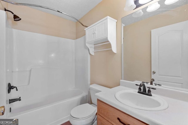 full bathroom featuring vanity, a textured ceiling, toilet, and washtub / shower combination