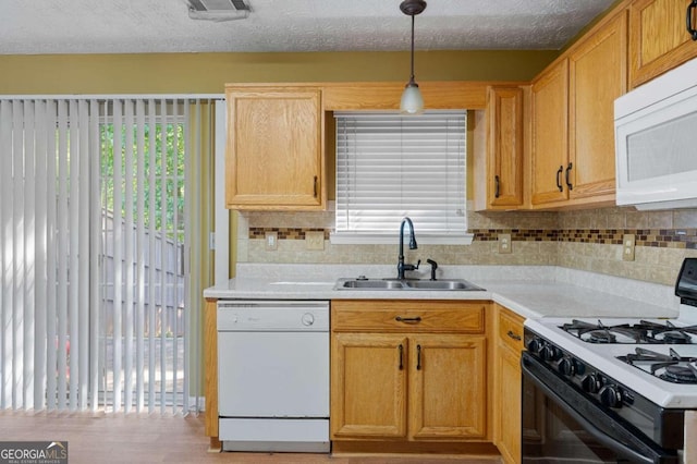 3127 Fields Dr, Stonecrest, GA 30038 - kitchen featuring white appliances, light countertops, decorative backsplash, and decorative light fixtures