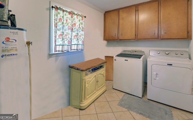 laundry area featuring light tile patterned floors, crown molding, washing machine and dryer, cabinets, and gas water heater