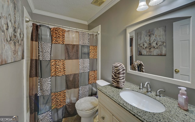 bathroom featuring crown molding, vanity, toilet, and a textured ceiling