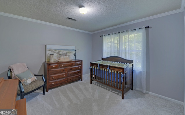 carpeted bedroom with crown molding and a textured ceiling