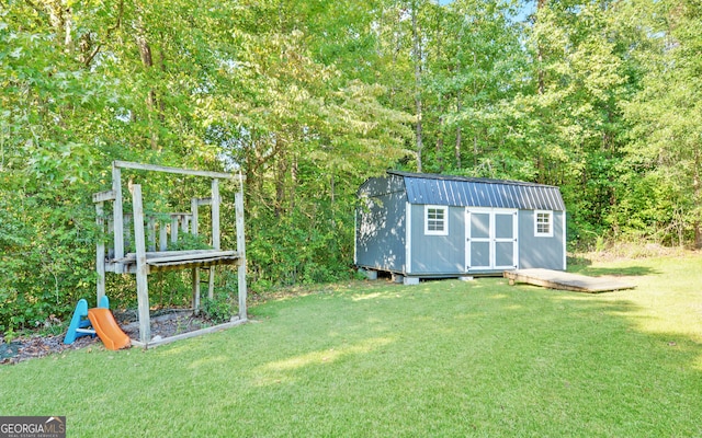 view of outbuilding with a yard