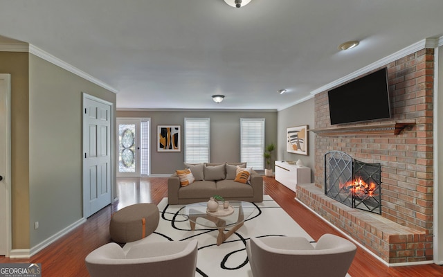 living room with crown molding, a fireplace, and hardwood / wood-style flooring