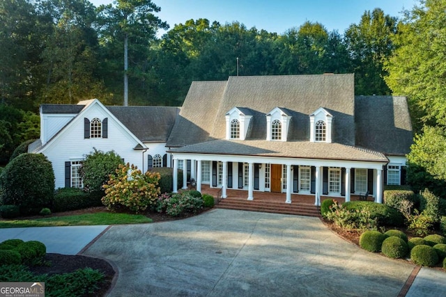 cape cod house with a porch