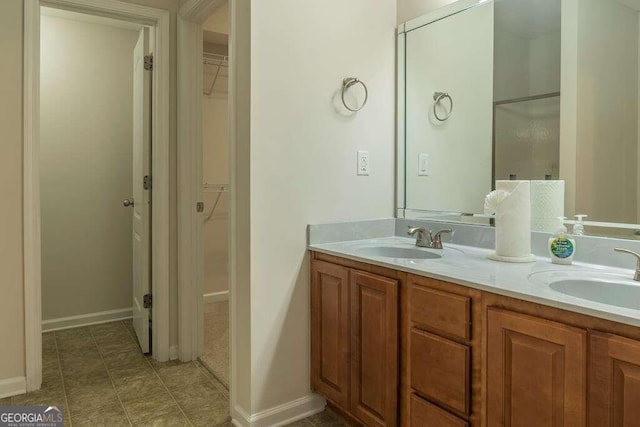 bathroom featuring tile patterned flooring and vanity