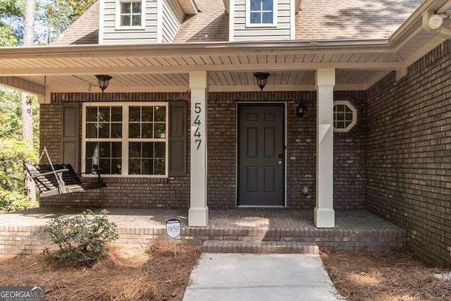 entrance to property with covered porch