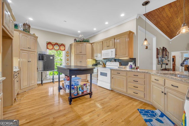 kitchen with white appliances, light hardwood / wood-style flooring, vaulted ceiling, sink, and hanging light fixtures