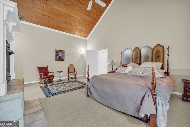 bedroom with ceiling fan, wood ceiling, light carpet, and high vaulted ceiling