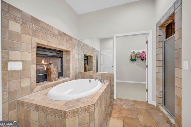 bathroom with tile patterned flooring and plus walk in shower