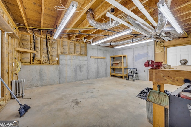 basement with radiator heating unit