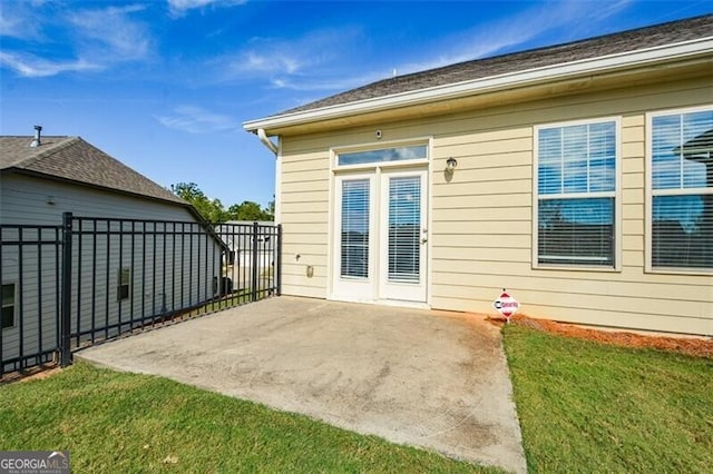 view of side of property with a yard and a patio area