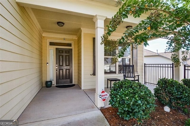 doorway to property featuring covered porch