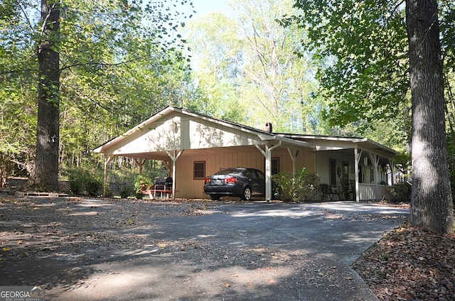 exterior space with a carport