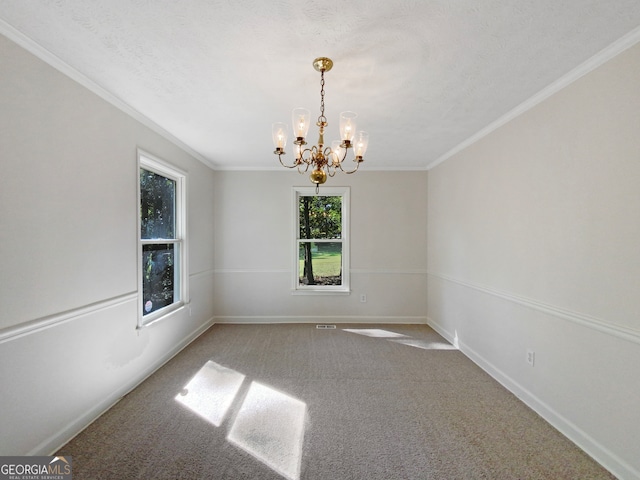 unfurnished room featuring crown molding, a chandelier, carpet, and a textured ceiling