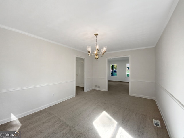 empty room featuring ornamental molding, carpet floors, and an inviting chandelier