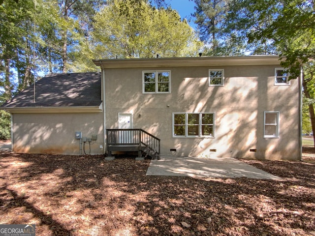 rear view of house featuring a patio