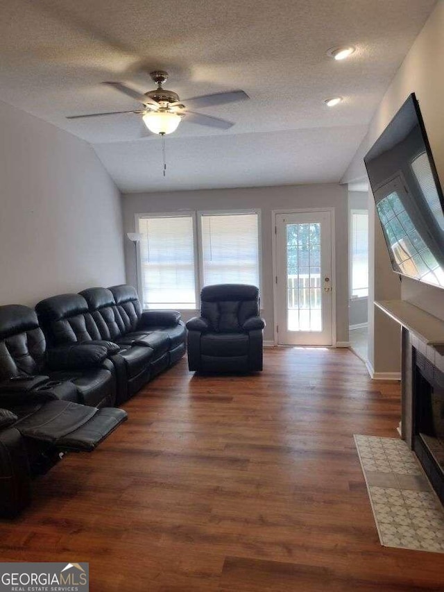 115 Elberta St, Mcdonough, GA 30253 - living area featuring ceiling fan, wood finished floors, and a textured ceiling