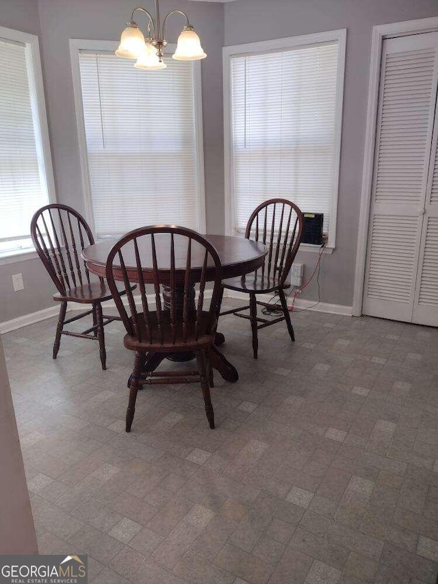 dining room with a notable chandelier