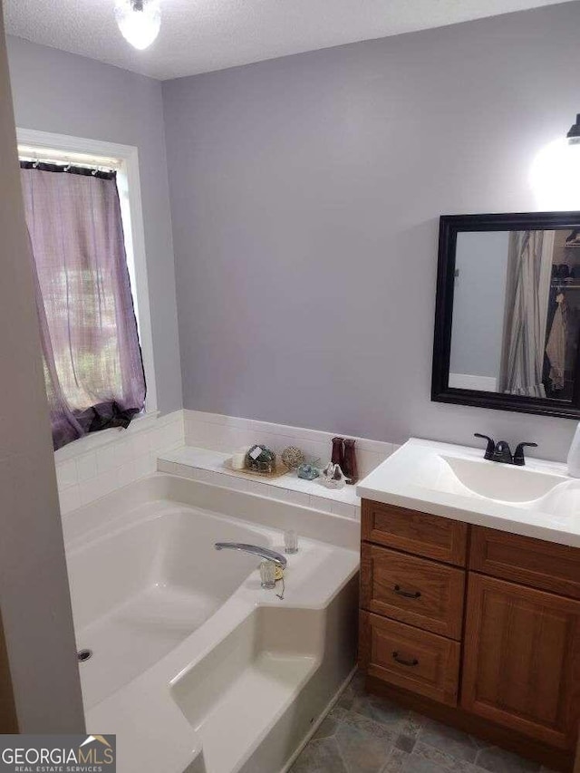 115 Elberta St, Mcdonough, GA 30253 - bathroom with a garden tub and vanity