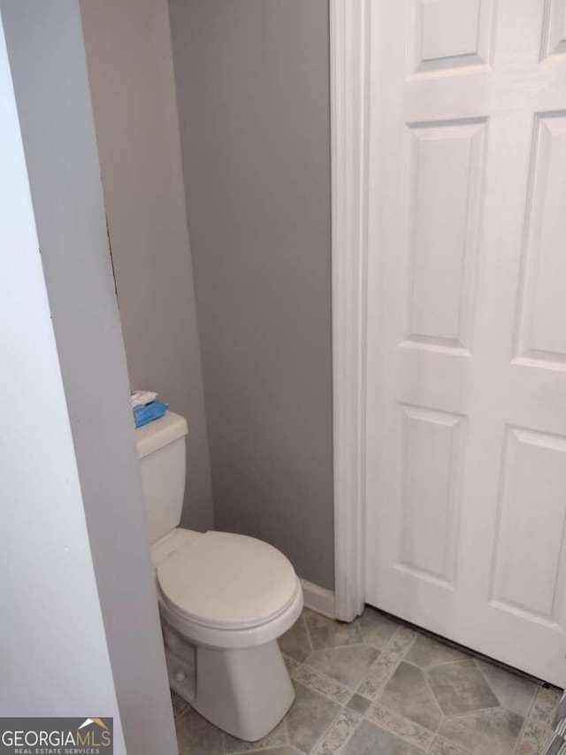 115 Elberta St, Mcdonough, GA 30253 - bathroom with toilet and baseboards