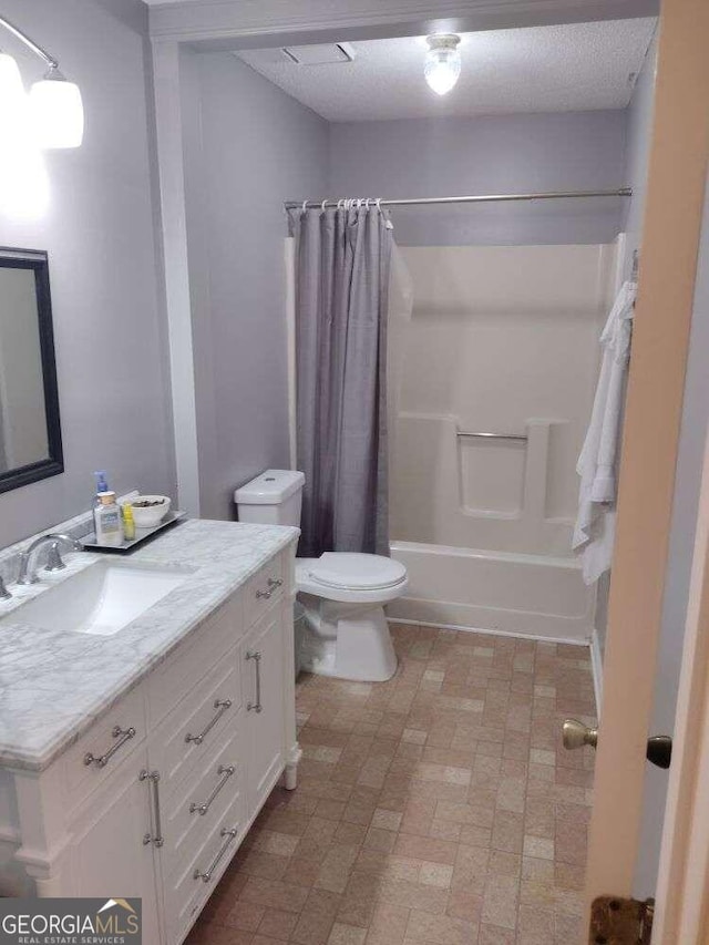 115 Elberta St, Mcdonough, GA 30253 - bathroom with shower / bath combo with shower curtain, vanity, toilet, and brick patterned floor