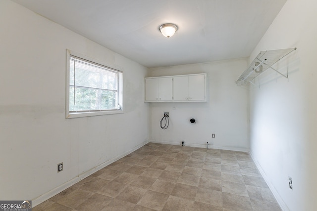 laundry room with hookup for an electric dryer, washer hookup, cabinets, and hookup for a gas dryer