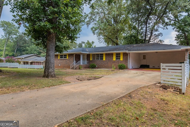 ranch-style home with a carport