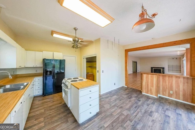 kitchen with white cabinetry, dark hardwood / wood-style flooring, white appliances, and sink