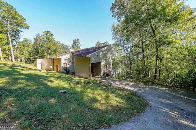 view of home's exterior featuring a yard