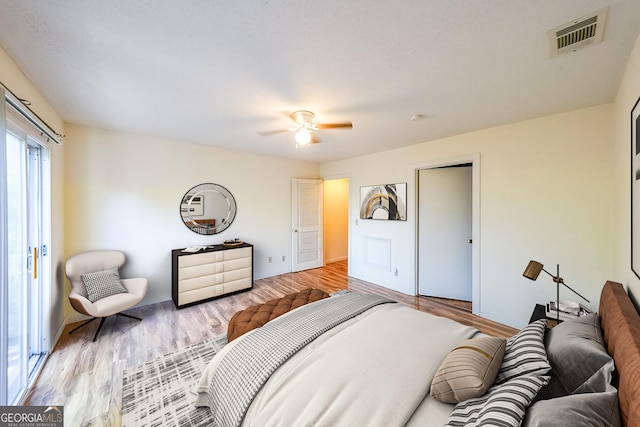 bedroom featuring light hardwood / wood-style floors and ceiling fan