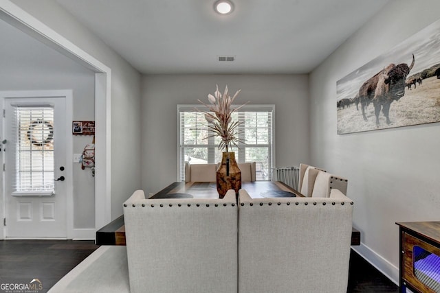 dining space with dark wood-type flooring